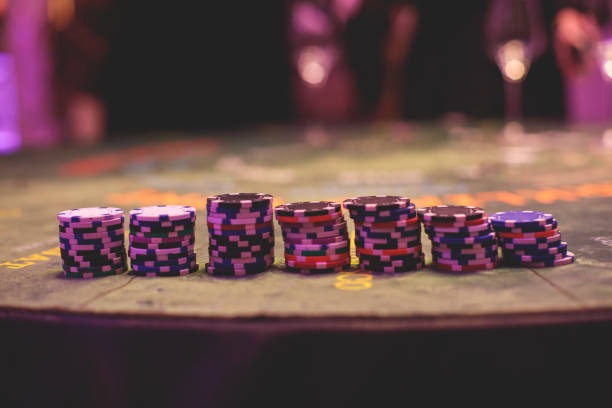Live dealer table with cards and chips displayed on screen